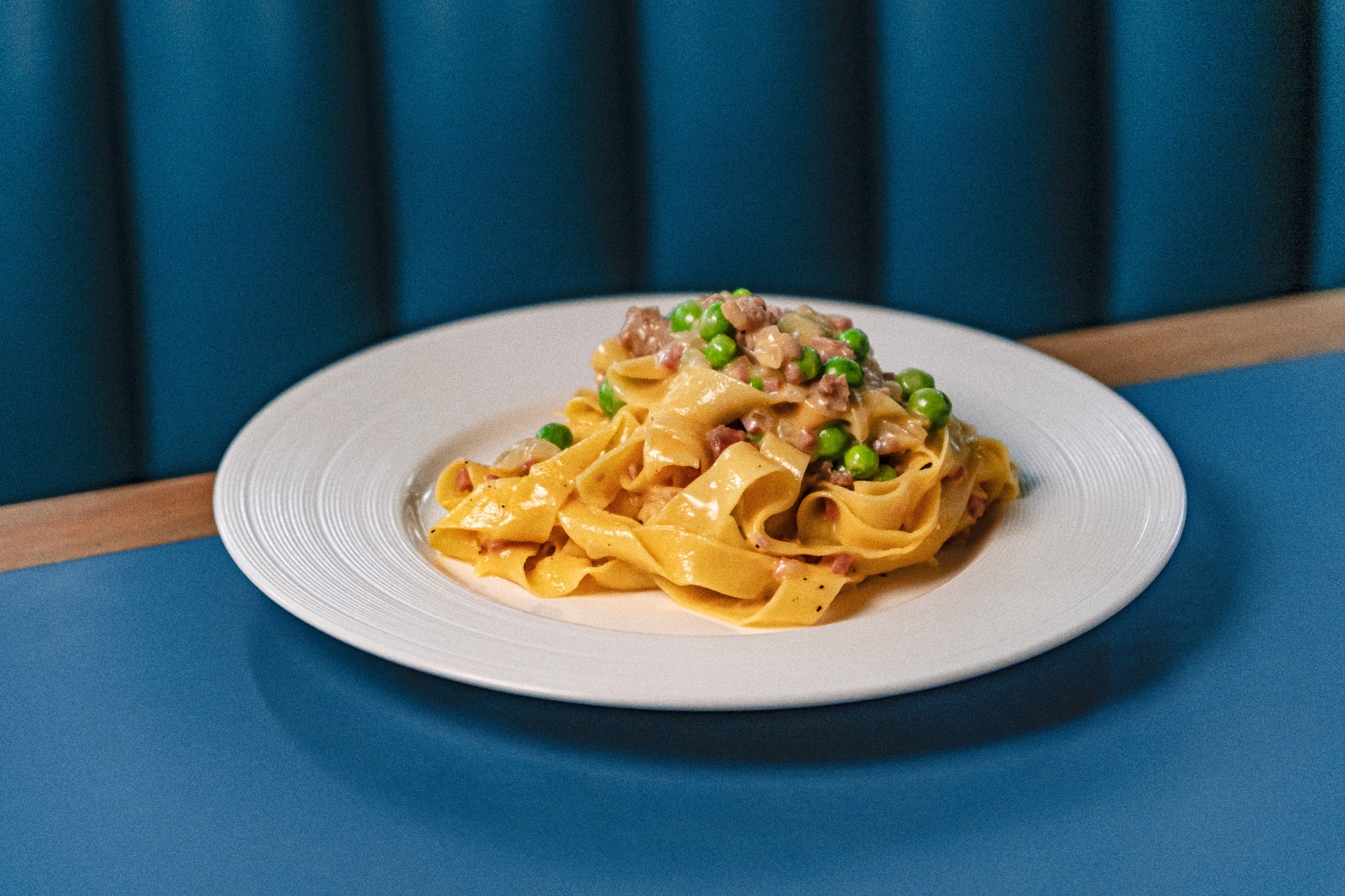 Formai-Q1-SMShoot-FoodDishes-260325-R1-7 Fettuccine alla Papalina at Forma - Handmade fresh egg pasta ribbons tossed with a creamy condiment of prosciutto cotto and eggs, complete with parmigiano, fresh peas, and black pepper.