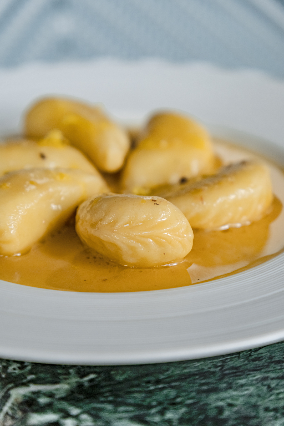 Formai-Q1-SMShoot-FoodDishes-260325-R1-24 Culurgionis d'Ogliastra at Forma - Hand-stitched Sardinian ravioli filled with Idaho potatoes, crab, and parsley, warmed through with butter, lemon juice, mint, and anchovies.