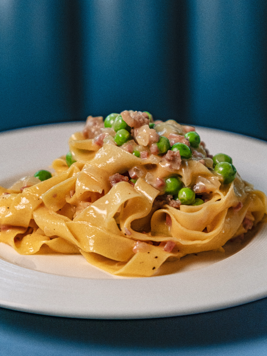 Formai-Q1-SMShoot-FoodDishes-260325-R1-5 Fettuccine alla Papalina at Forma - Handmade fresh egg pasta ribbons tossed with a creamy condiment of prosciutto cotto and eggs, complete with parmigiano, fresh peas, and black pepper.